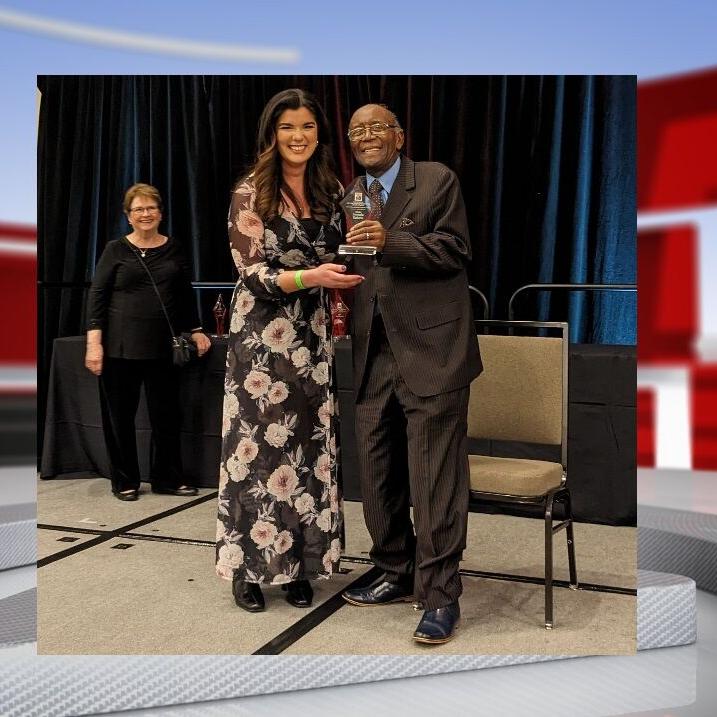 Amanda Roberts receives an award.jpg